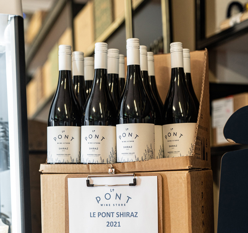 Displayed wine bottle labels designed for Le Pont Wine Store
